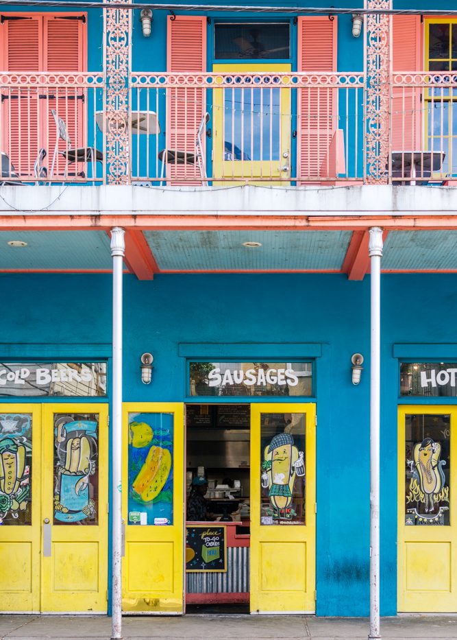 Colourful shop fronts with a balcony in New Orleans.