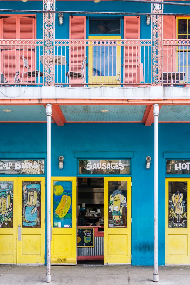 Colourful shop fronts with a balcony in New Orleans.