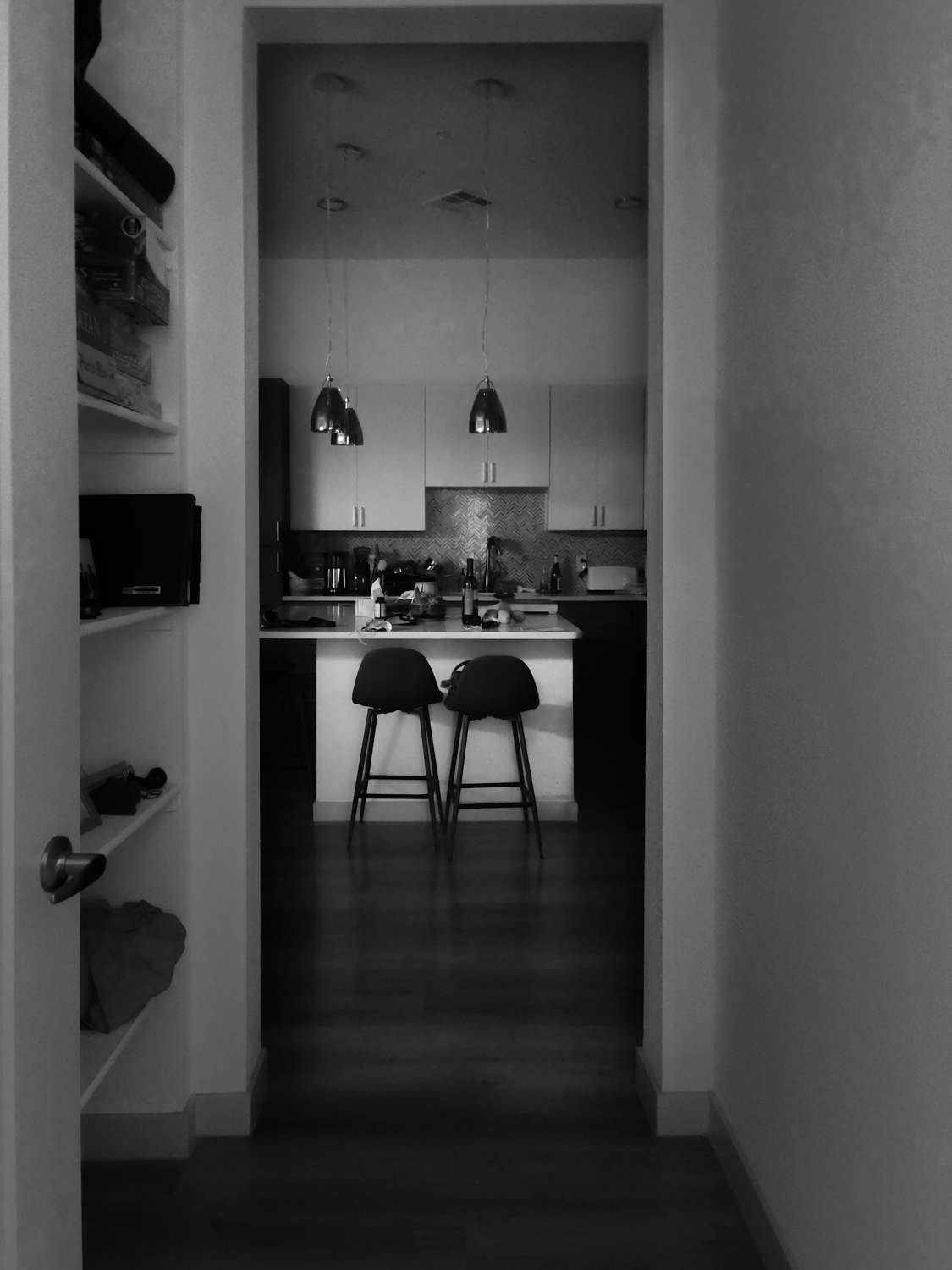 Black and white photo of the interior of an apartment.