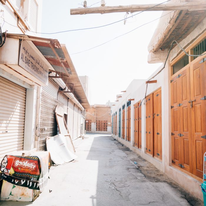 Photograph of an empty alley in a souq/market in Bahrain where all the market stalls are closed